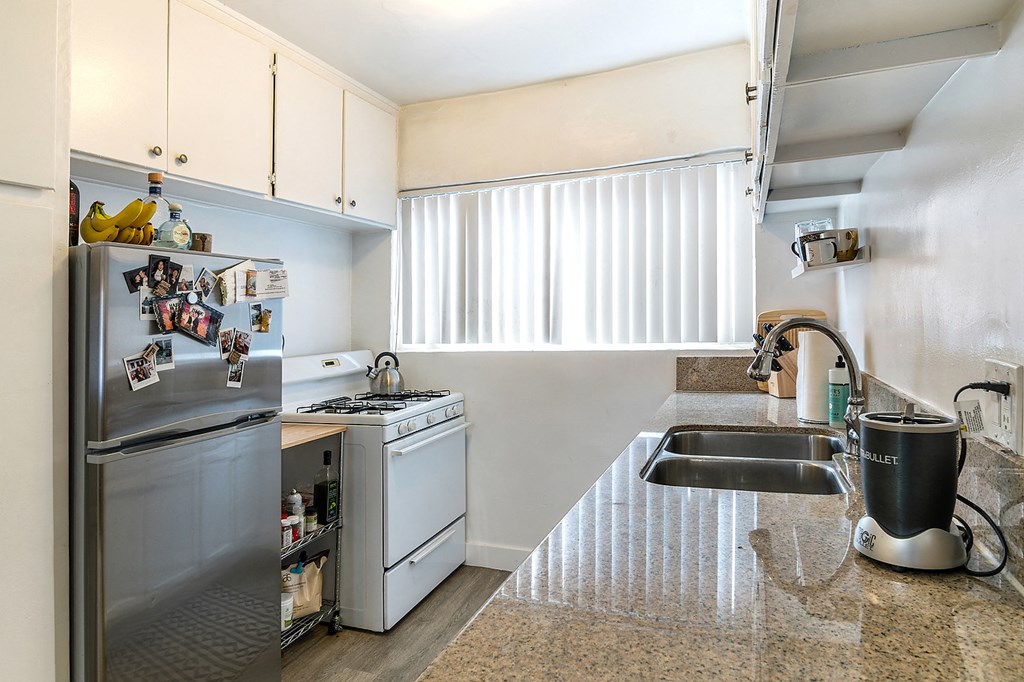 a kitchen with stainless steel appliances and a sink