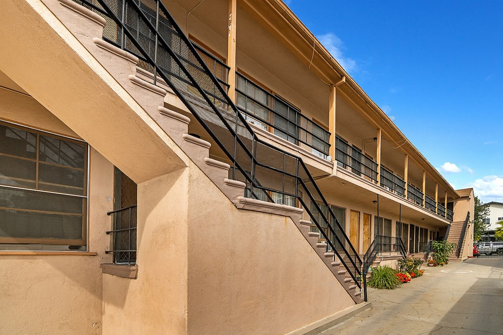 an exterior view of a building with a staircase on the side