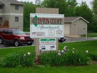 a sign for the gatton college of restaurants in front of a house