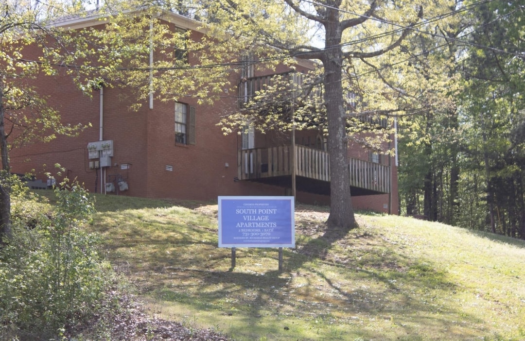 an image of a building with a sign in front of it