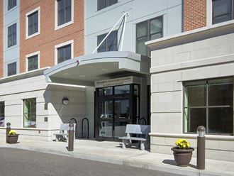 the front entrance of a building with a wheelchair accessible ramp