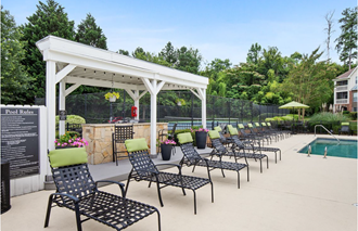 the pool and lounge area of our apartments for rent