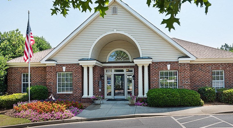 a church with an flag in front of a building