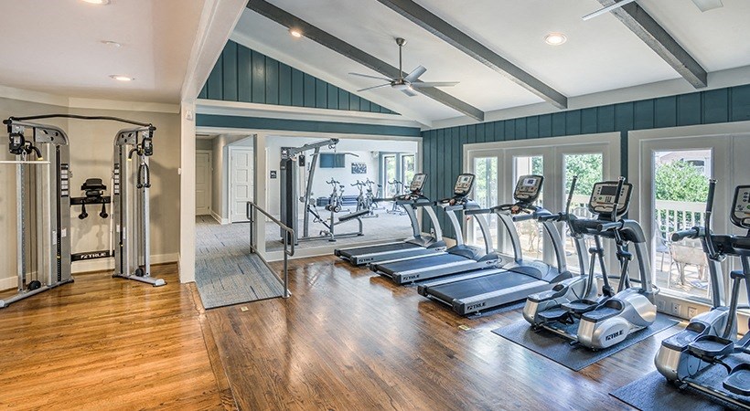 the gym is equipped with a variety of cardio machines and weights