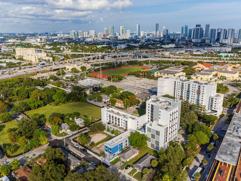 an aerial view of a city with buildings and a park