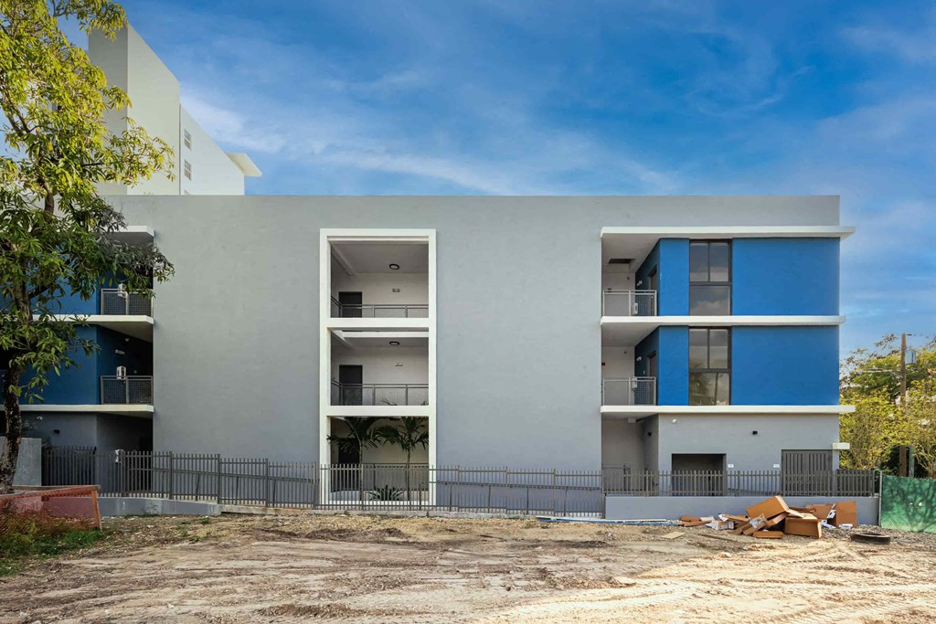 a building with a fence in front of it