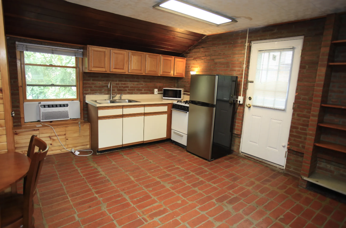 a kitchen with a refrigerator and a sink