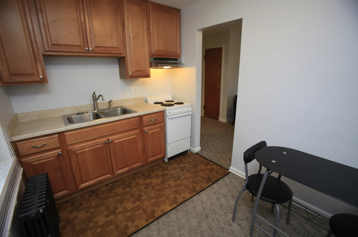 a small kitchen with a stove and a sink
