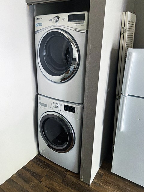 a washing machine and a refrigerator in a small room