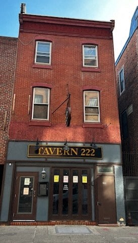 a brick building with a sign on the front of it