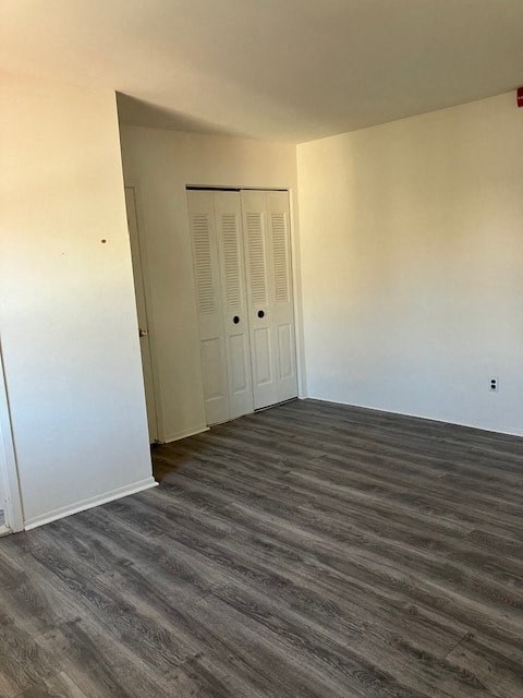 an empty room with white walls and a door