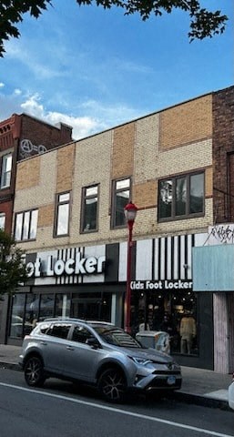 a car parked on the street in front of a building