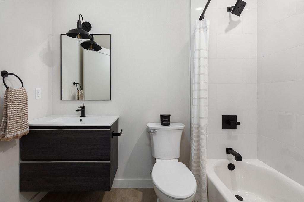 a small bathroom with a toilet sink and shower