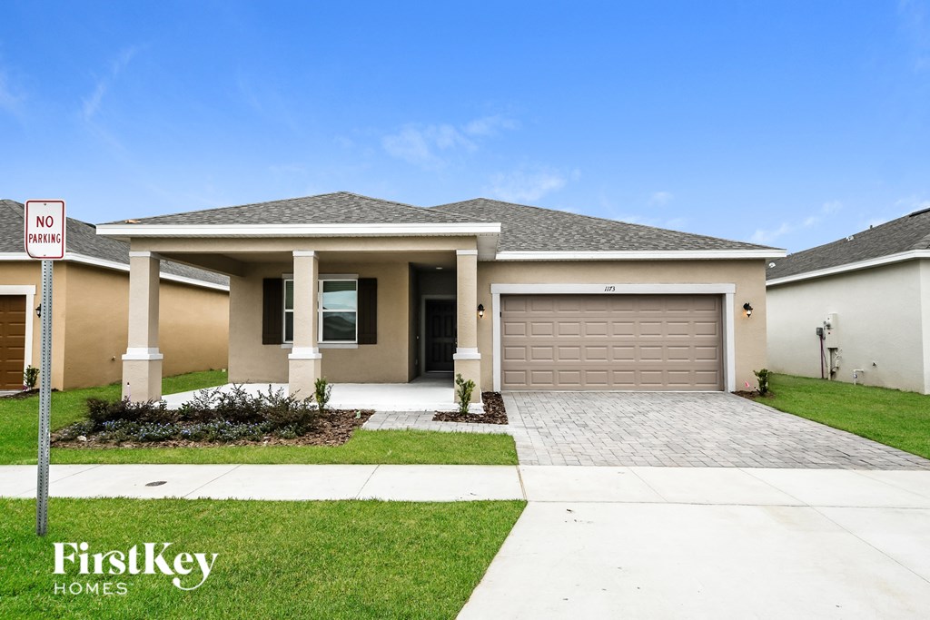 a house with a driveway and a garage door