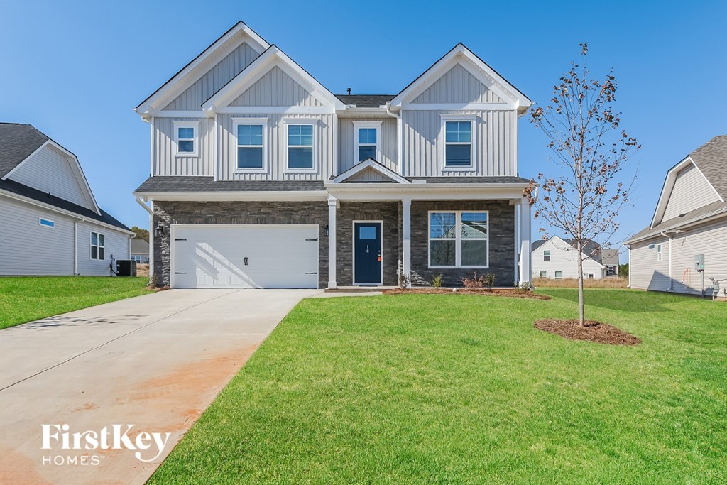 A large house with a garage is for sale.