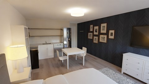 a living room and dining room with a table and a tv