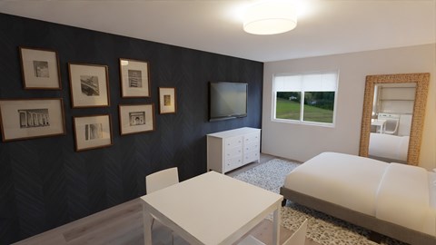 a bedroom with a bed and a table and a television