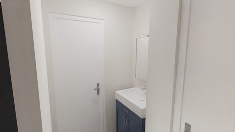 a small bathroom with a sink and a white door