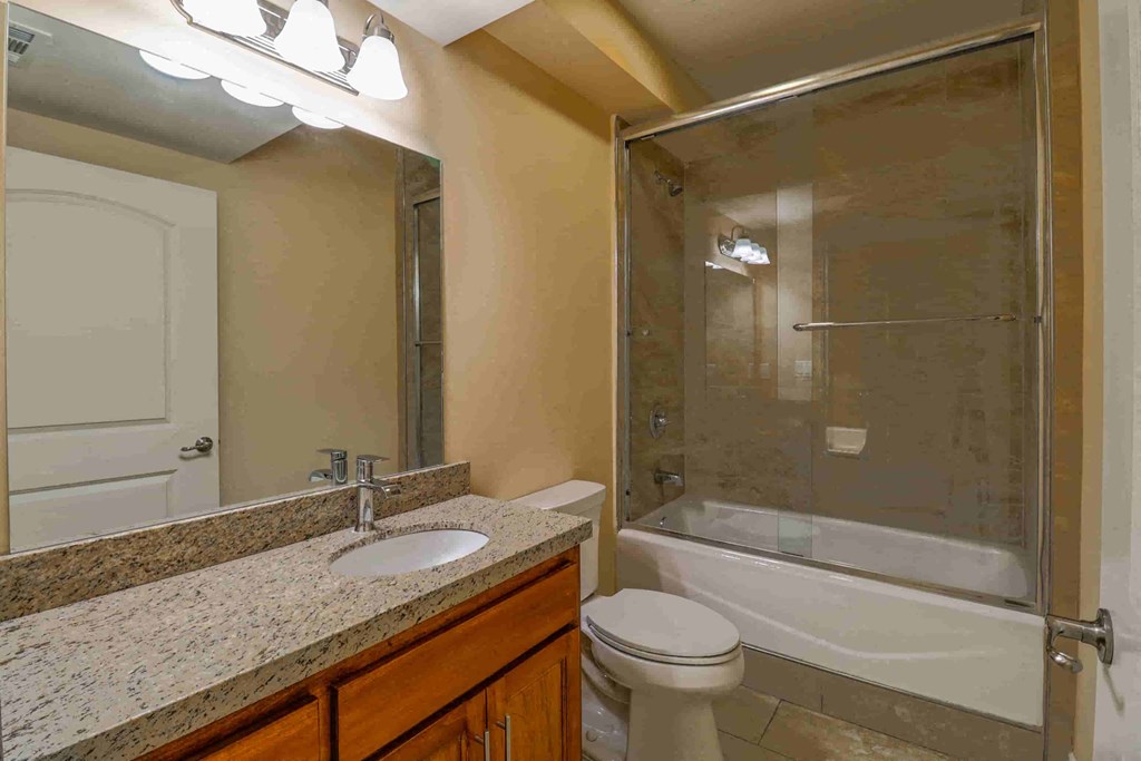 a bathroom with a sink toilet and a shower