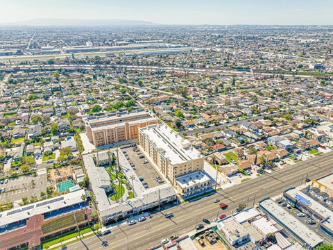an aerial view of a city with cars and buildings