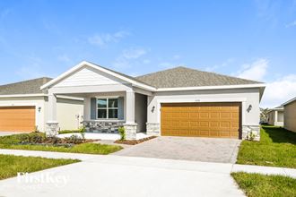 a house with a garage door in front of it
