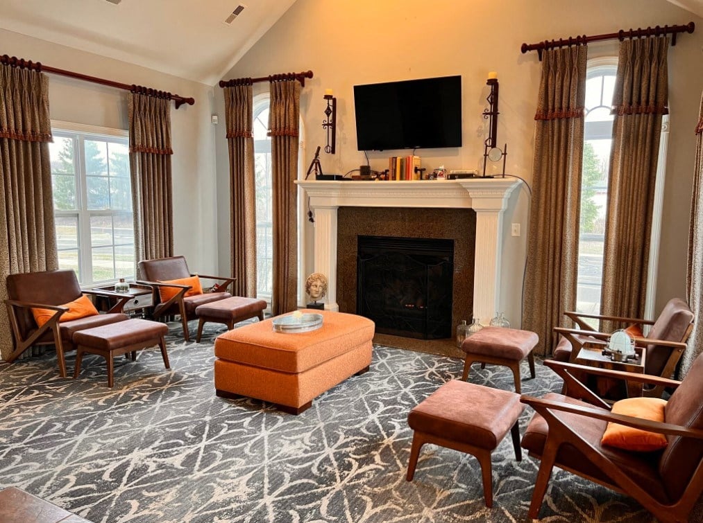 a living room filled with furniture and a fireplace