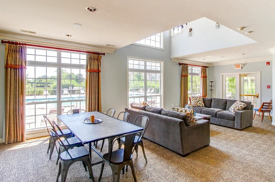a living room with a table and a couch