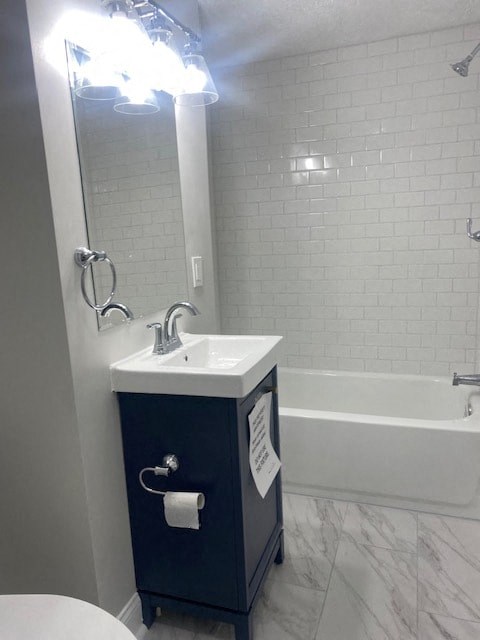 a bathroom with a sink and a tub and a mirror