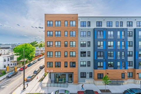 A multi-story apartment building with the word "DUO" on the front.