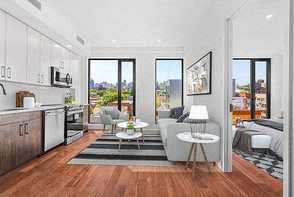 an apartment with a living room and a kitchen