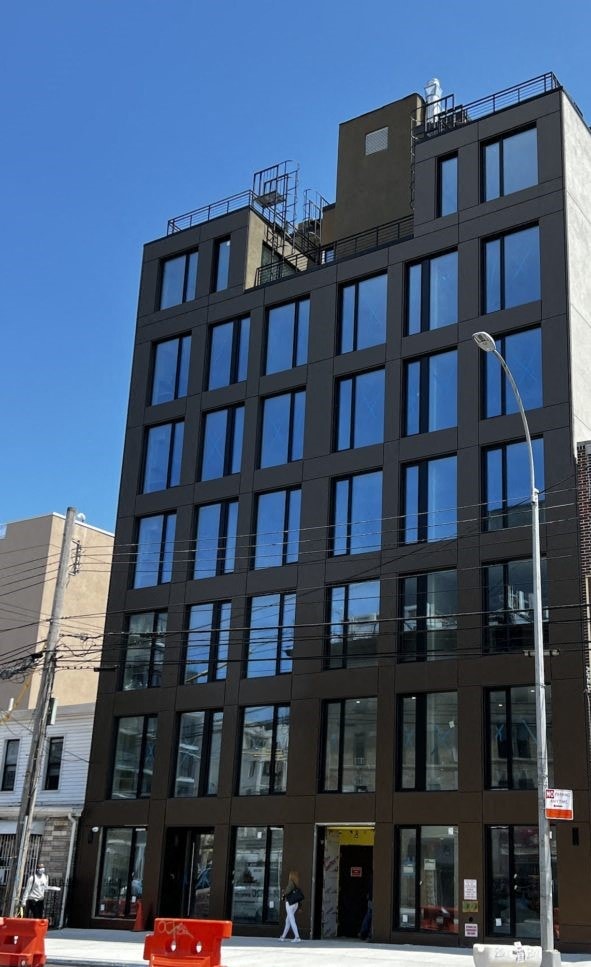 a tall building with a street light in front of it