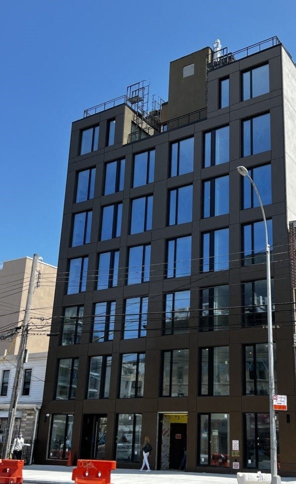 a tall building with a street light in front of it