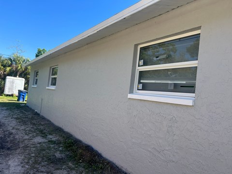 a window on the side of a house