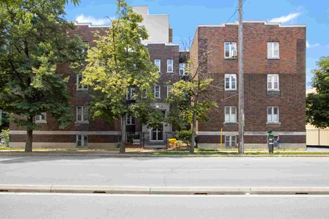 a view of an apartment building from the street