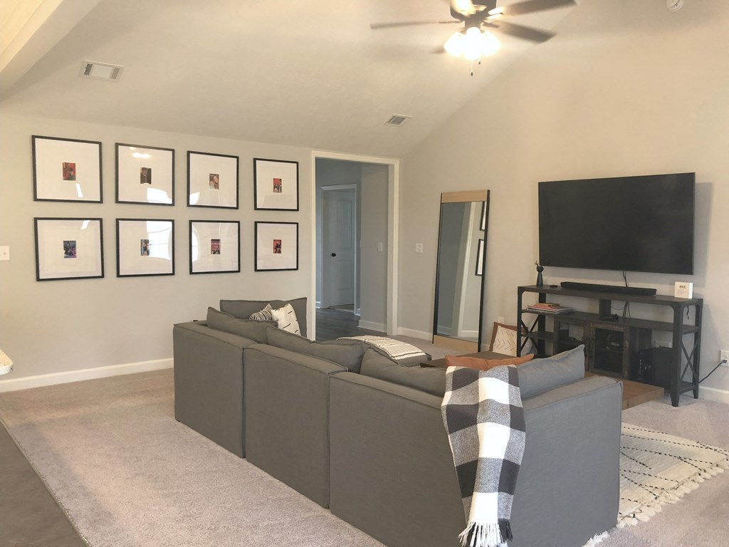 a living room with a couch and a tv