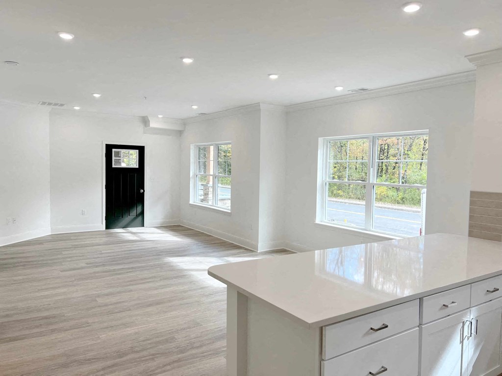 the kitchen and living room in a new home