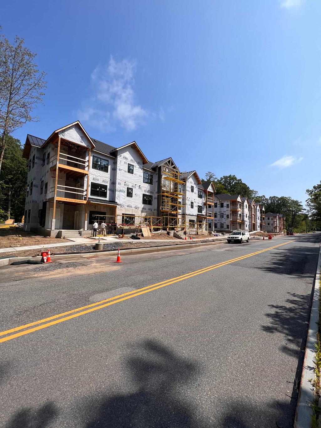 a building under construction on the side of a street