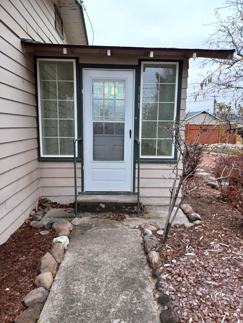 A white door with a glass window is closed.