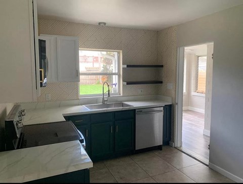a kitchen with a sink and a window