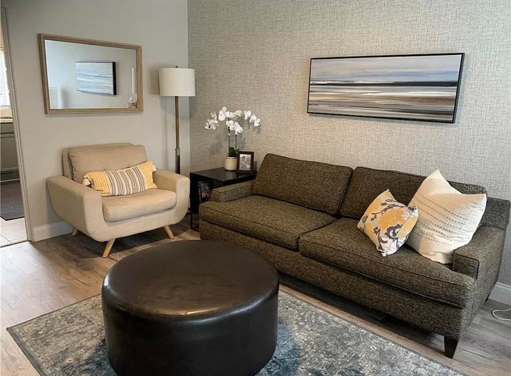 a living room with a couch and a chair