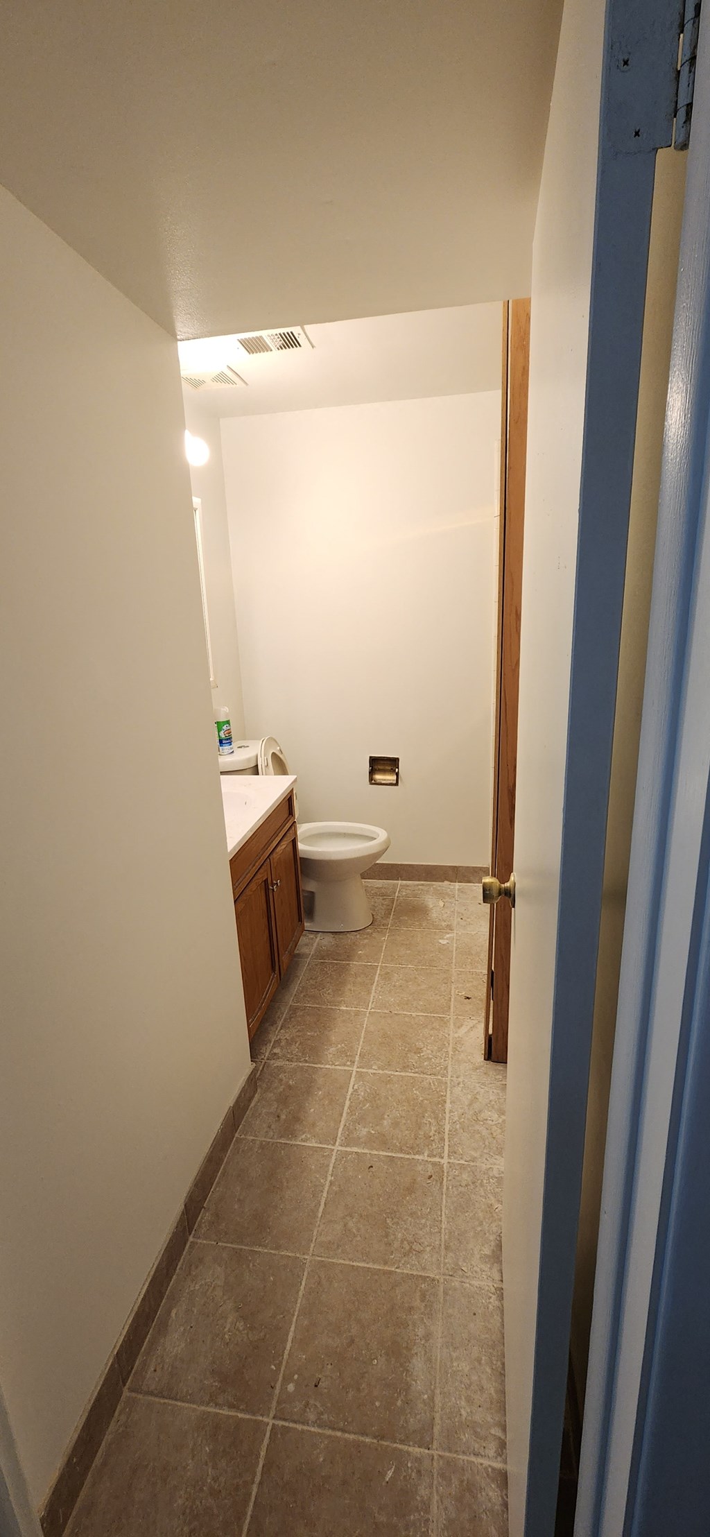 a bathroom with a toilet and a sink in it