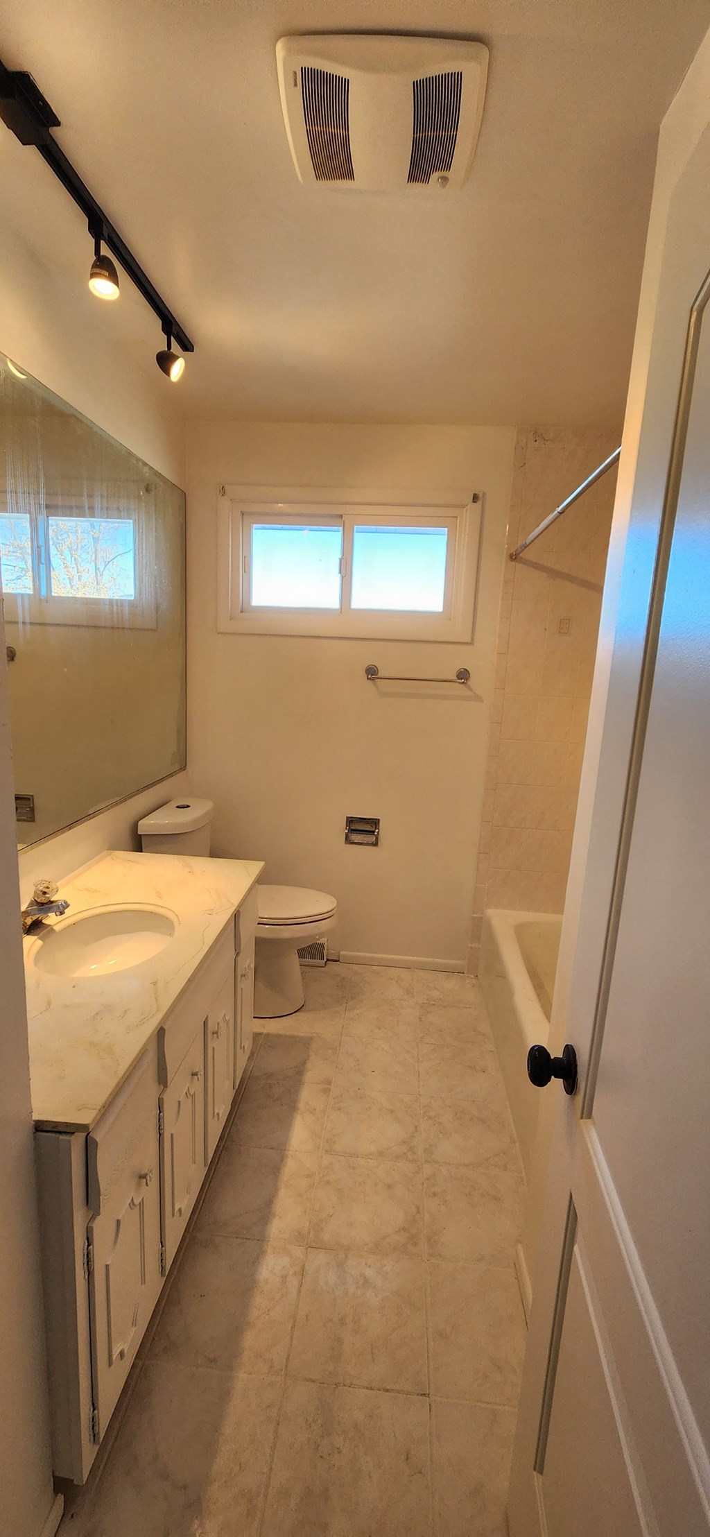 a bathroom with a sink toilet and a shower