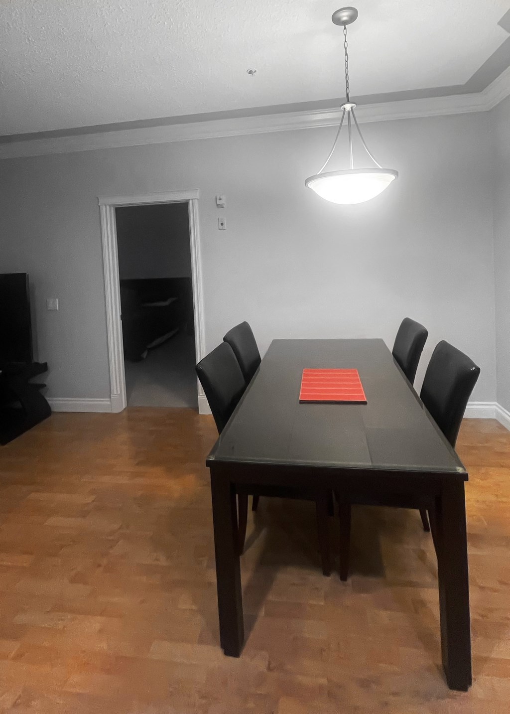 a dining room with a table and chairs