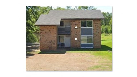 this is a picture of a brick house with the letter b on it