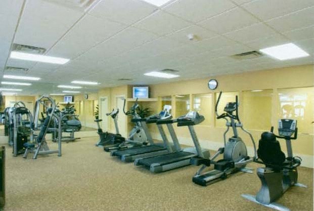 a gym with several pieces of exercise equipment