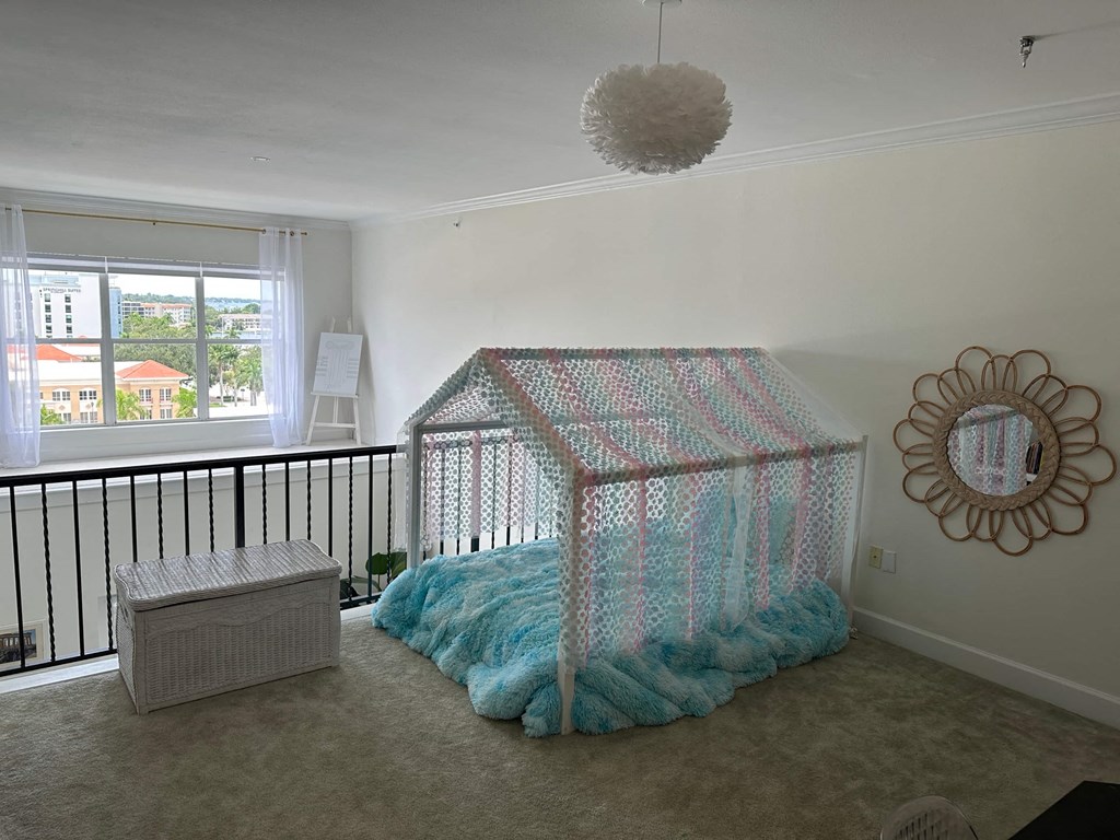 a bedroom with a crib in the corner of a room