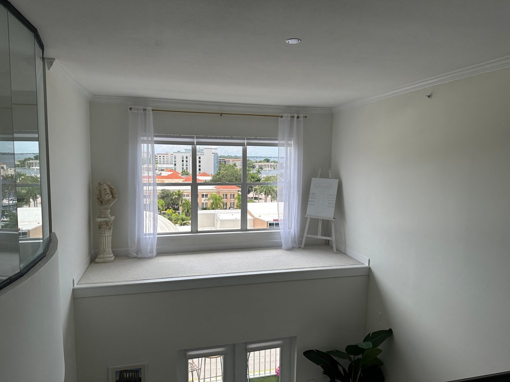 a room with a window with a view of the city