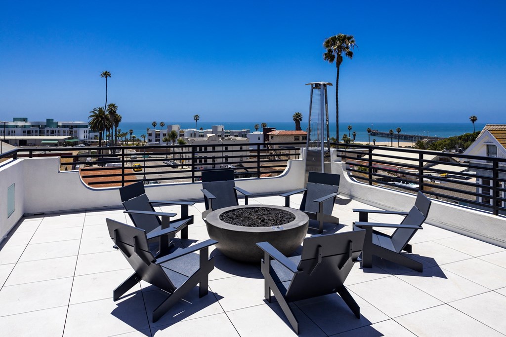 the terrace of the ocean view suites has a fire pit and views of the