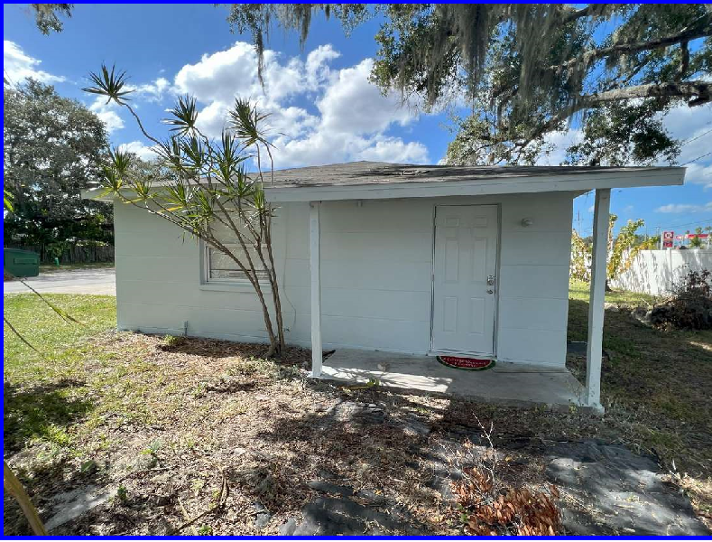 a small white house with a white door