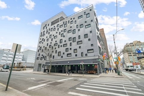 a building on the corner of a street in a city